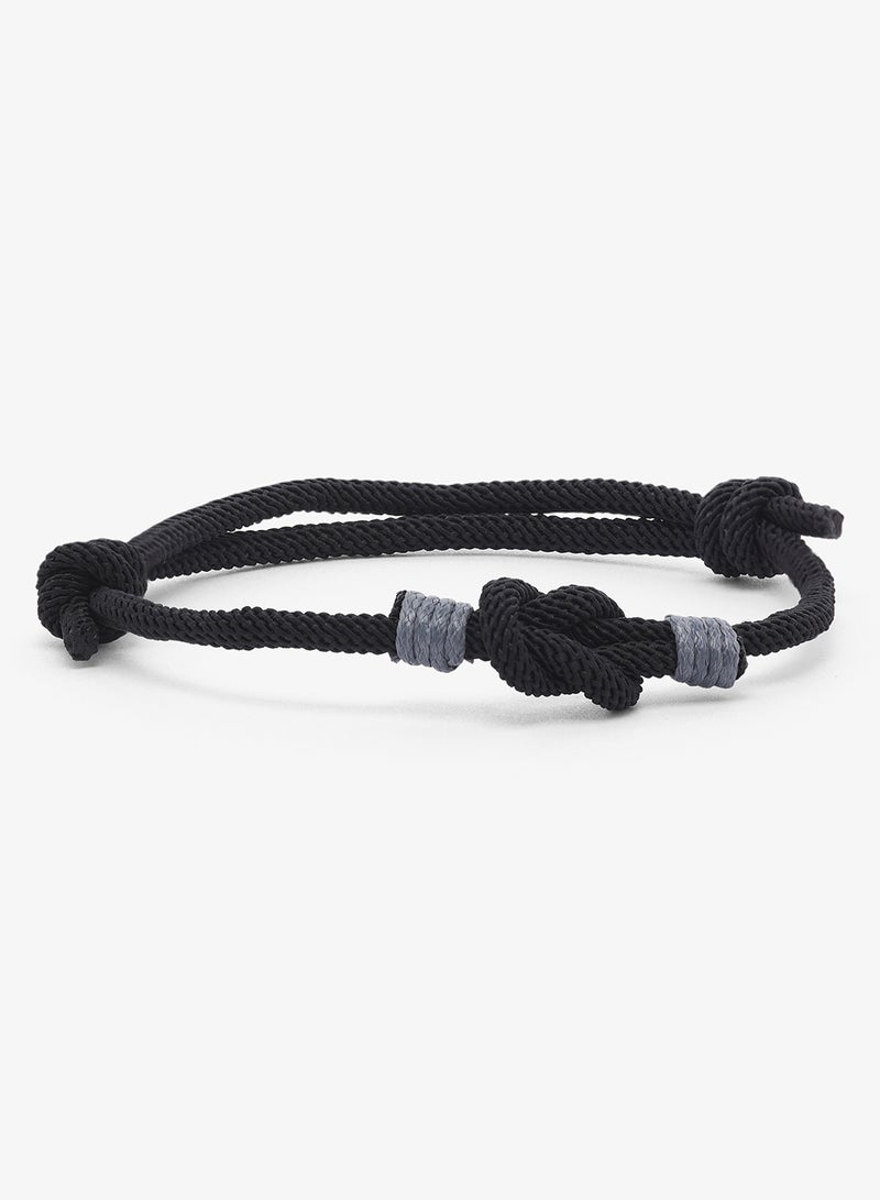 Seventy Five Cord Bracelet Featuring Central Knot Motif - Image 1